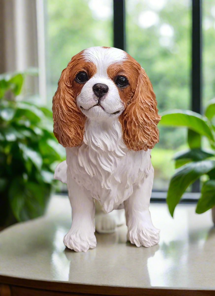 figurine of a Blenheim cavalier king charles spaniel