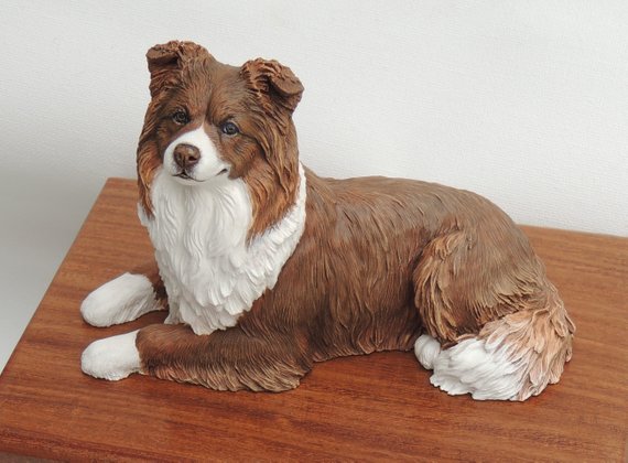 Red & white border collie sculpture